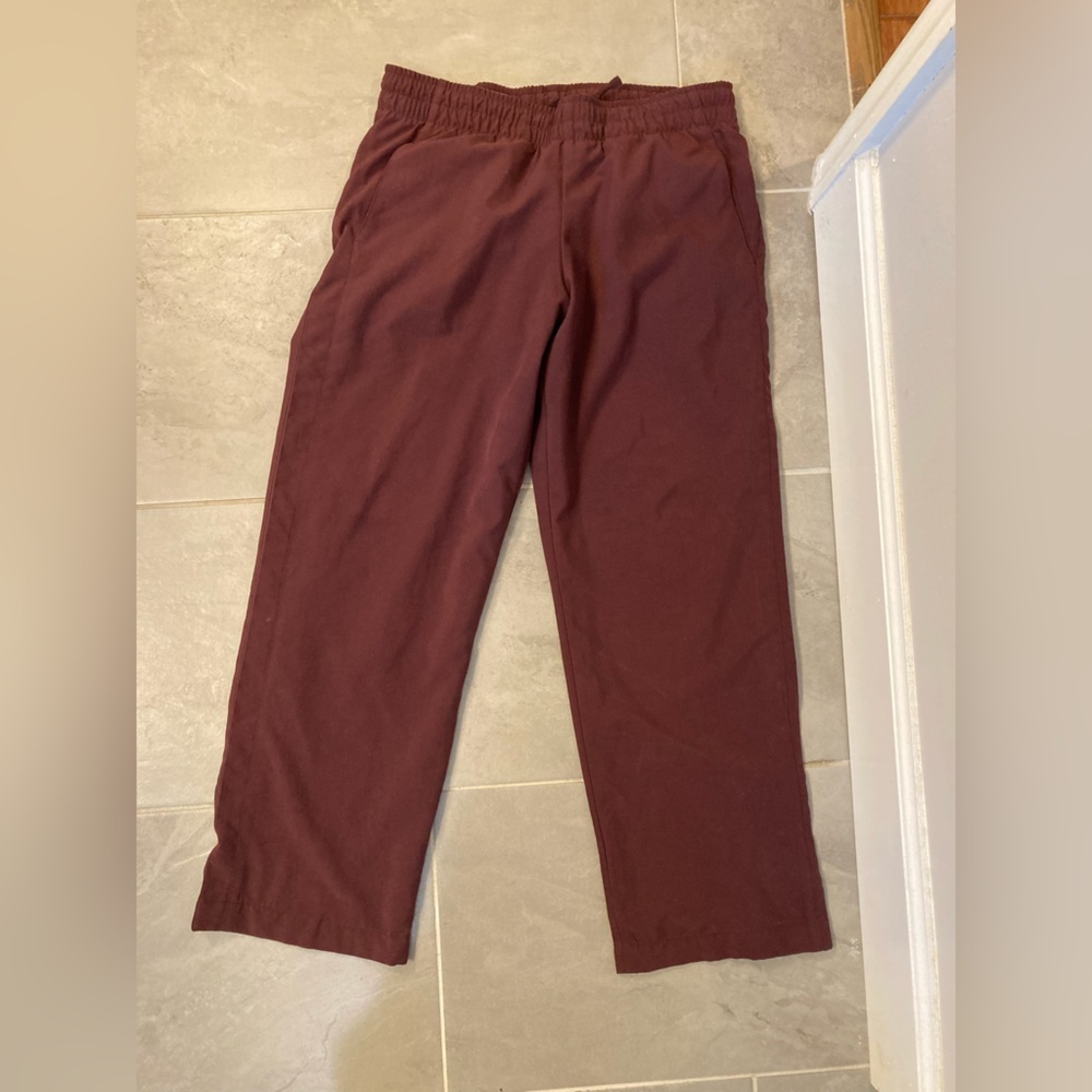 Nike sportswear purple pants with drawstrings and mesh inner lining size small.